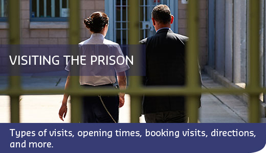 Man and woman walking through prison gates