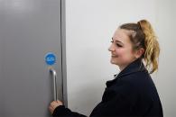 Female officer holding a door handle